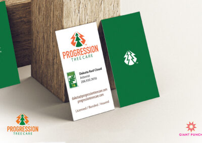 A business card created by Giant Punch. Which has a tree symbol, celebrating nature and heritage.