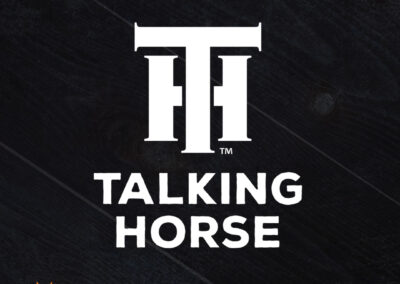 A bold and rustic logo by Giant Punch for our friends at Talking Horse Equine Massage features a monogram of the letters "T" and "H" resembling a ranch brand.