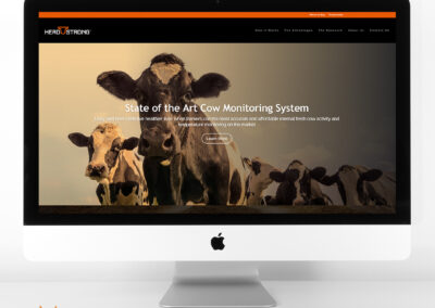 A herd of cattle displayed on a desktop computer screen for the Herd Strong website.