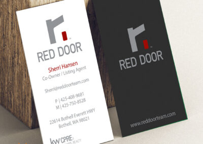 A sleek and professional Red Door business card designed by Giant Punch.