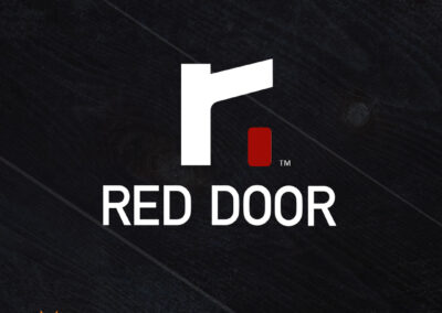 A sleek, vibrant lowercase "r" hugging a vibrant Red Door – the Red Door Real Estate logo.